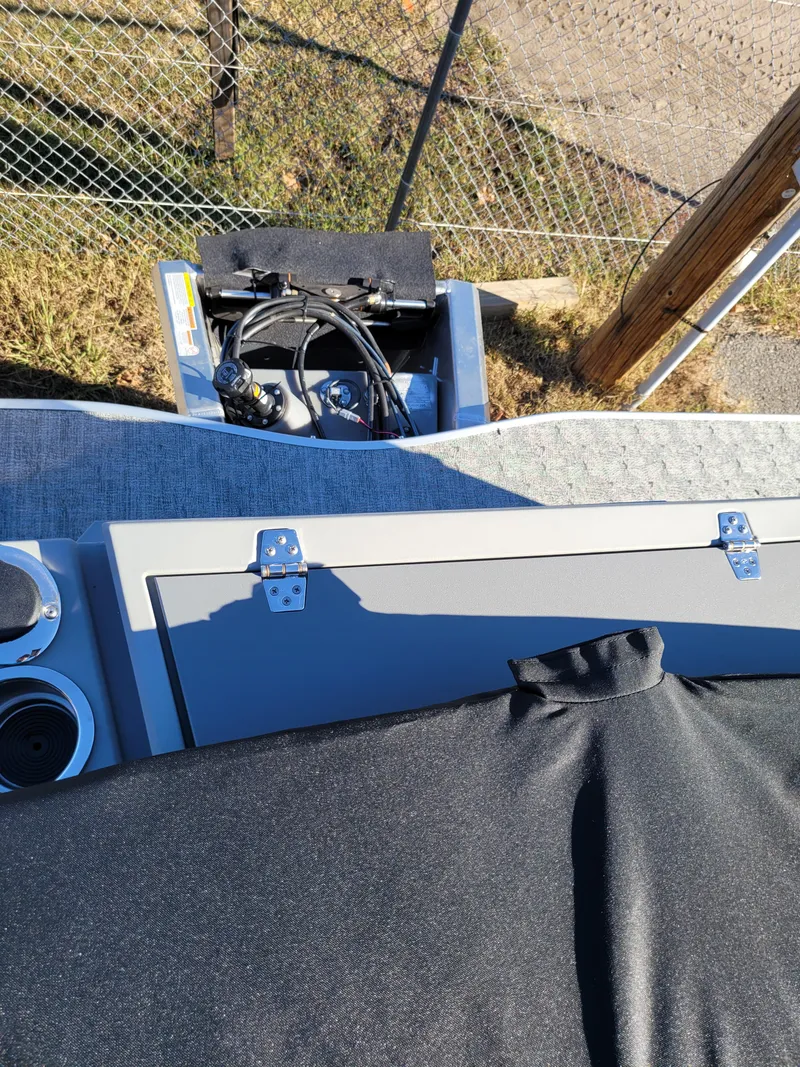 Slide: The Image of 2025 Trifecta 22TRFCLE boat interior with storage compartment and wiring. - 7