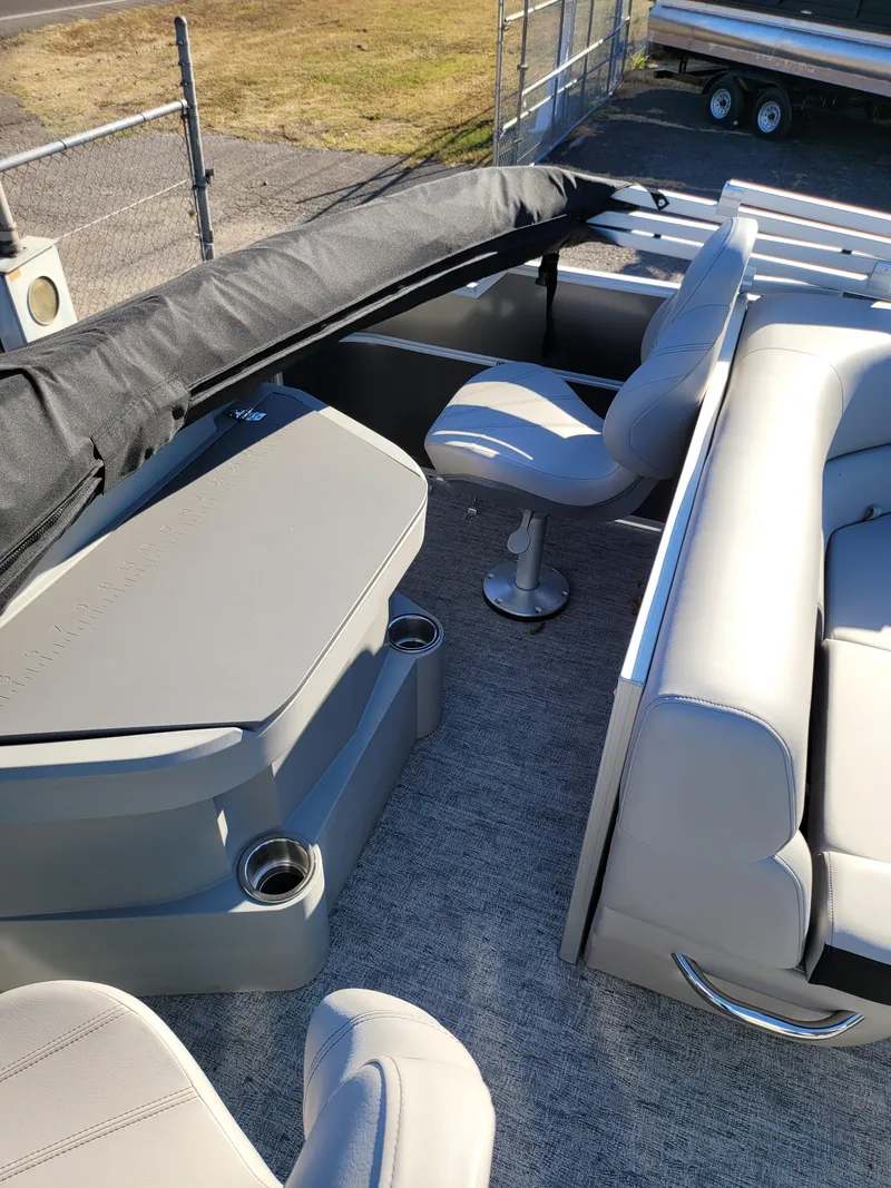 Slide: The Image of 2025 Trifecta 22TRFCLE pontoon boat interior with seating and table. - 8