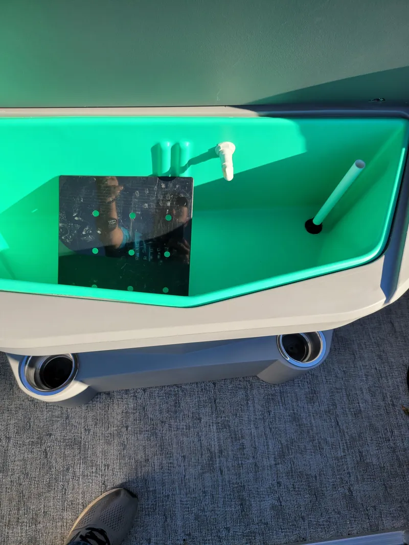 Slide: The Image of Interior view of 2025 Trifecta 22TRFCLE boat with storage compartment. - 9