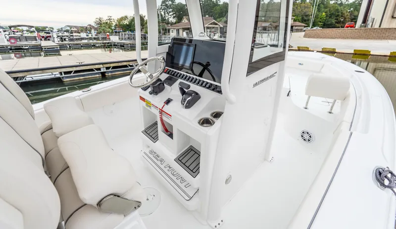 Slide: The Image of 2025 Sea Hunt Ultra 245 SE boat interior with modern helm and seating. - 8