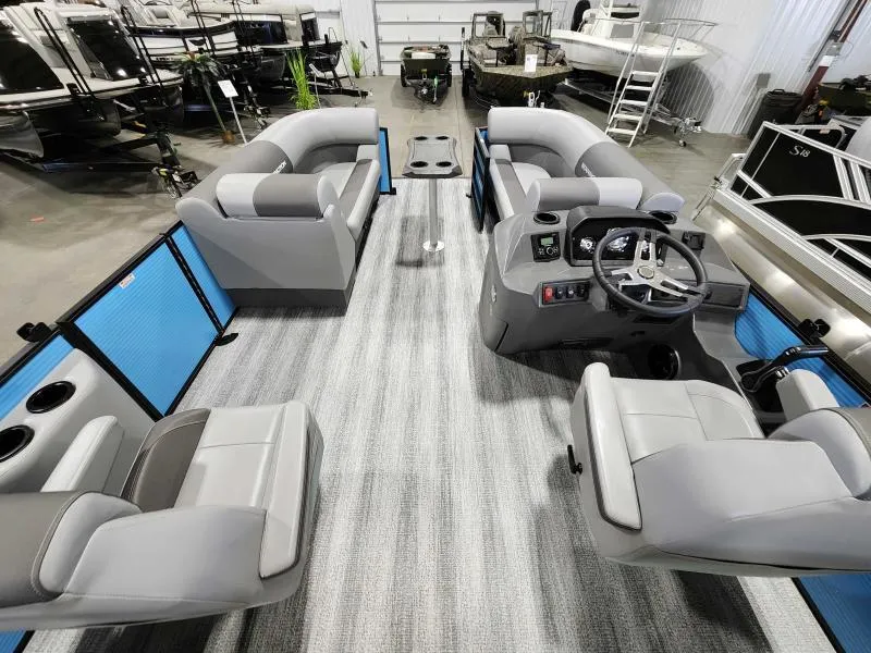 Slide: The Image of 2025 Bennington 20SSR pontoon boat interior with modern seating and steering console. - 5