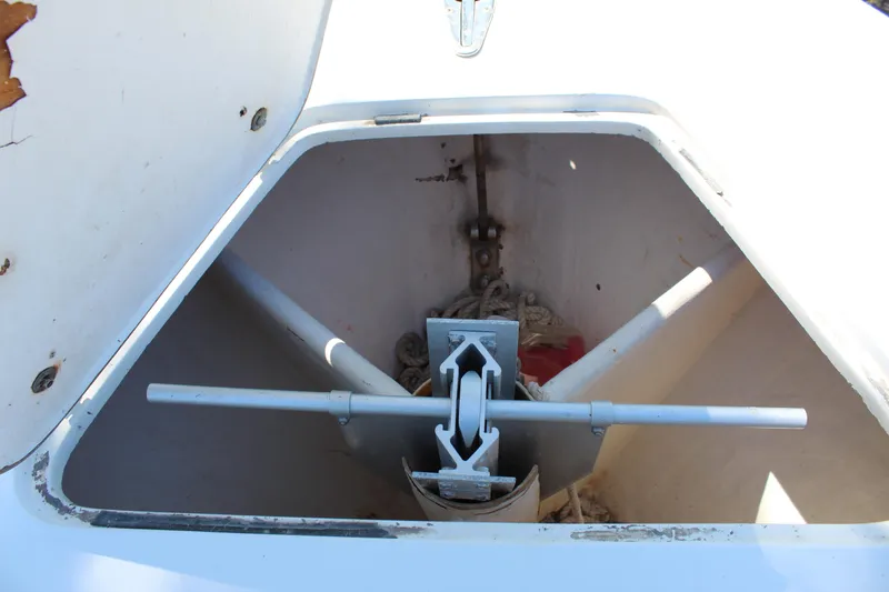 Slide: The Image of Anchor storage compartment on a 2002 Contender 31 CC boat. - 14