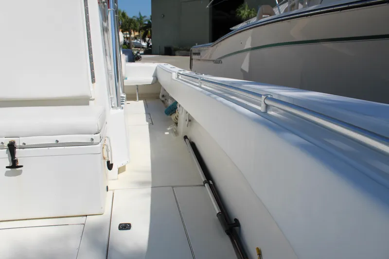 Slide: The Image of 2002 Contender 31 CC boat deck, white interior, side view. - 20