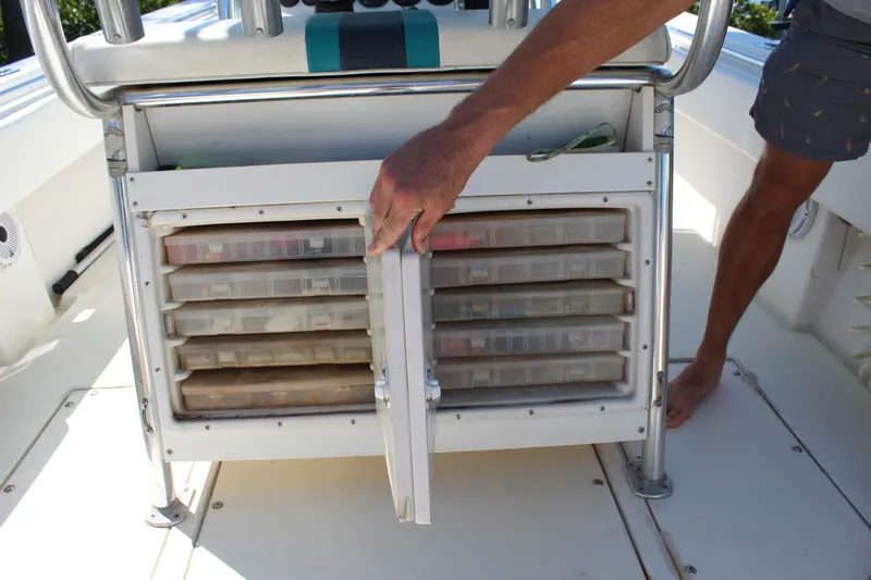 Slide: The Image of Contender 31 CC 2002 boat with tackle storage compartments open. - 28
