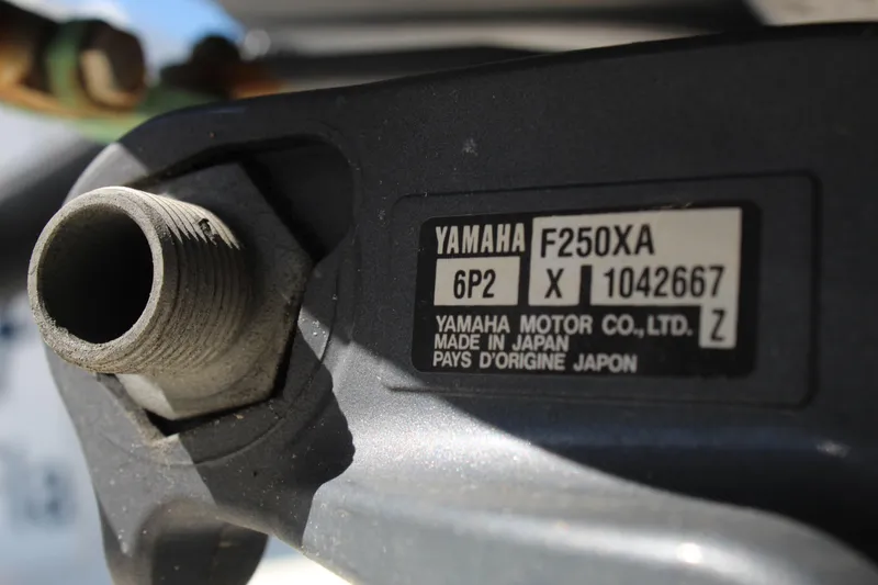 Slide: The Image of Close-up of Yamaha F250XA engine label on 2002 Contender 31 CC boat. - 31