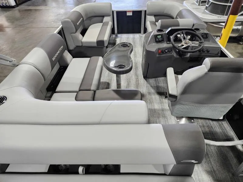 Slide: The Image of 2025 Bennington 168SLJ pontoon boat interior with gray seating and steering console. - 5