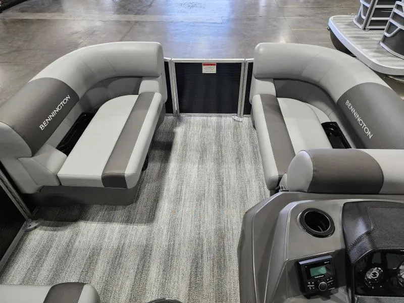 Slide: The Image of 2025 Bennington 168SLJ pontoon boat interior with gray seating and carpeted floor. - 7
