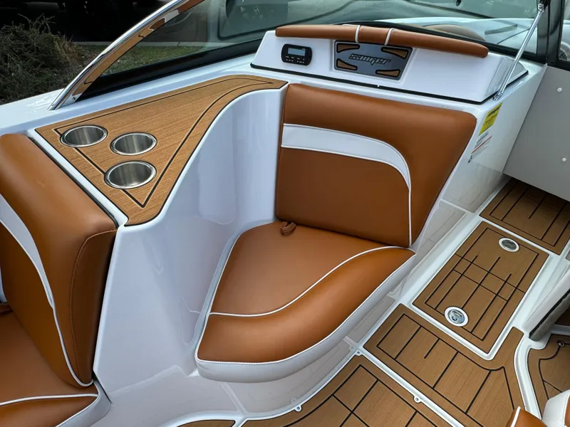Slide: The Image of 2025 Sanger 231SL boat interior with tan leather seats and wood accents. - 10