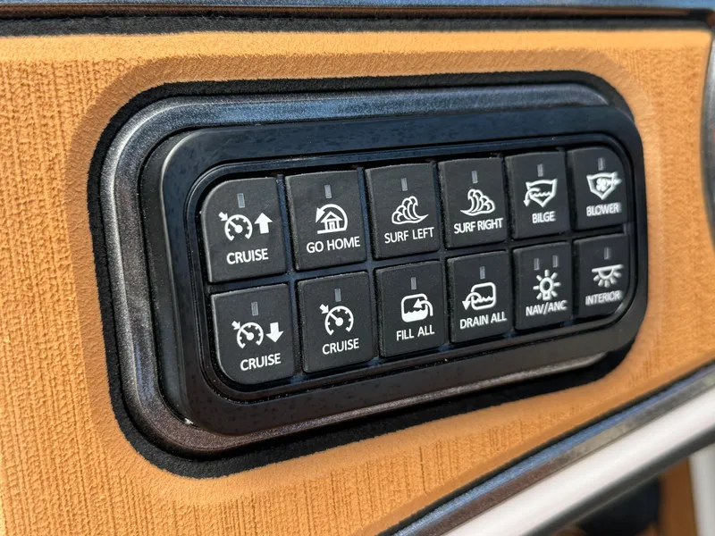 Slide: The Image of Control panel of 2025 Sanger 231SL boat with various function buttons. - 20