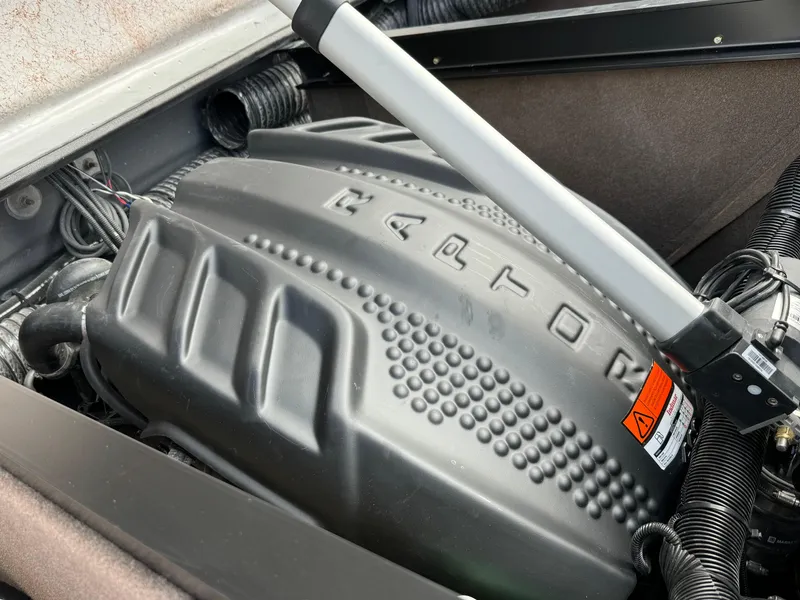 Slide: The Image of 2025 Sanger 231SL engine compartment with detailed cover and components. - 30