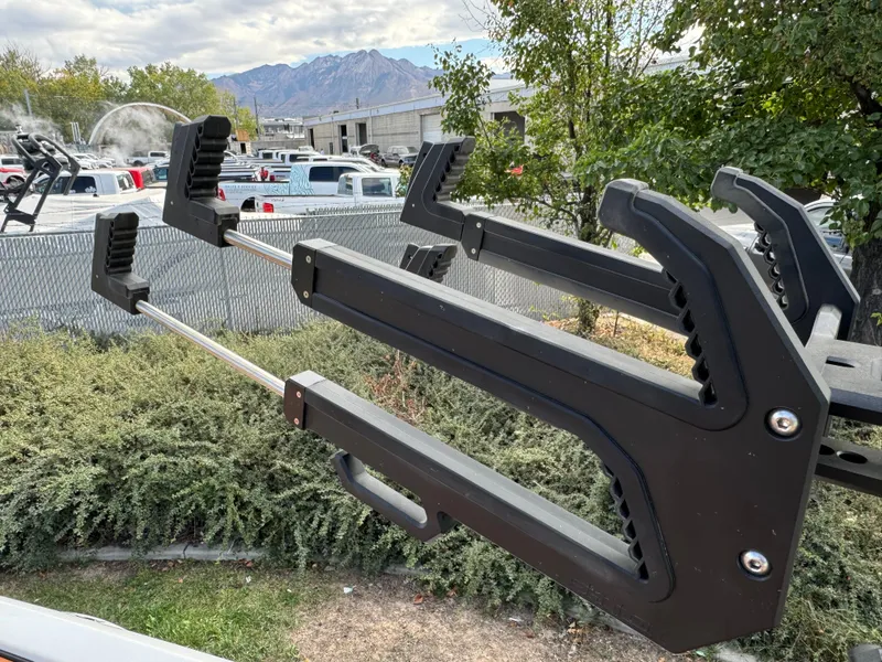 Slide: The Image of Sanger 231SL 2025 boat rack with mountain backdrop and greenery. - 31