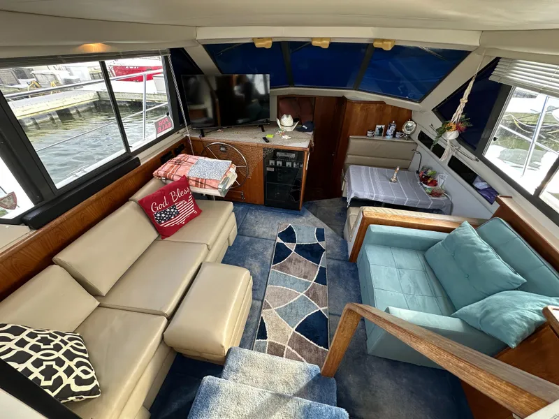 Slide: The Image of Interior of 1994 Carver 350 Aft Cabin Motor Yacht with cozy seating and modern decor. - 11