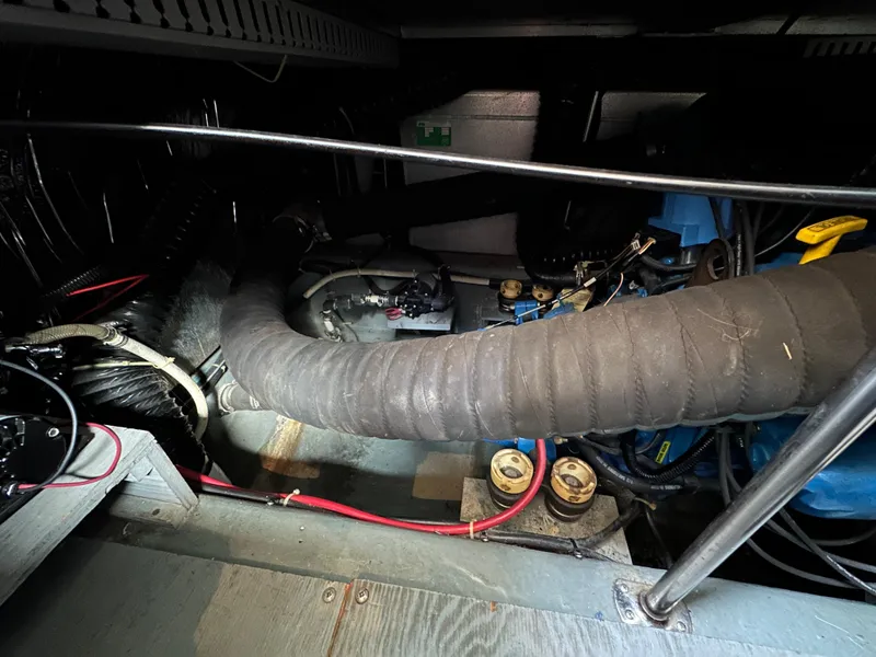 Slide: The Image of Engine compartment of a 1994 Carver 350 Aft Cabin Motor Yacht, showcasing mechanical components. - 23