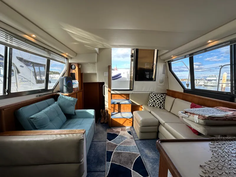 Slide: The Image of Luxurious interior of 1994 Carver 350 Aft Cabin Motor Yacht with plush seating. - 10