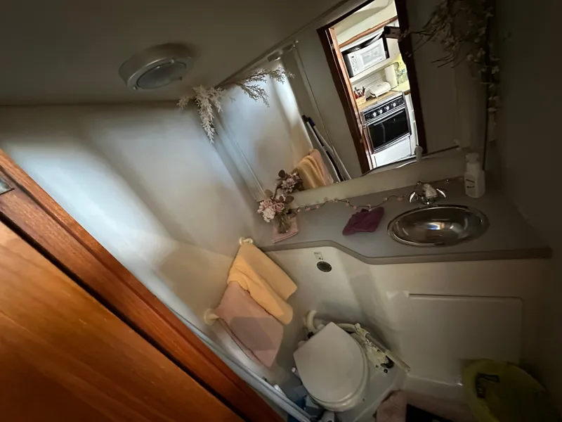 Slide: The Image of Bathroom interior of 1994 Carver 350 Aft Cabin Motor Yacht with sink and toilet. - 18