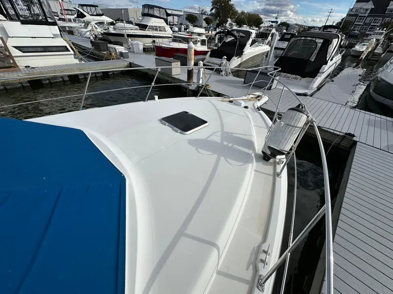 Slide: The Image of 1994 Carver 350 Aft Cabin Motor Yacht docked at marina with other boats. - 2
