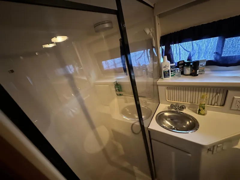 Slide: The Image of Bathroom interior of 1994 Carver 350 Aft Cabin Motor Yacht with sink and shower. - 22