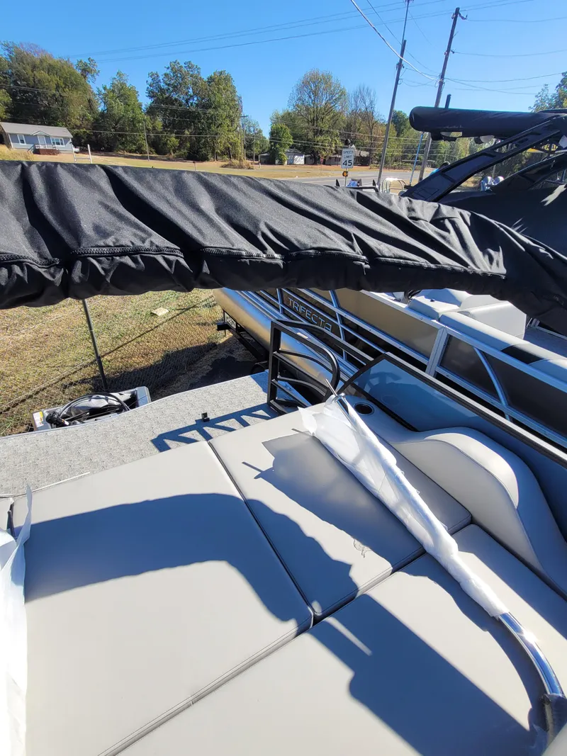 Slide: The Image of 2025 Trifecta 24ULLET275 boat with canopy, sleek seating, and modern design. - 15