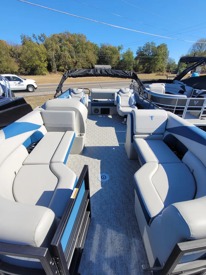 Slide: The Image of 2025 Trifecta 24ULLET275 pontoon boat with spacious seating and modern design. - 4