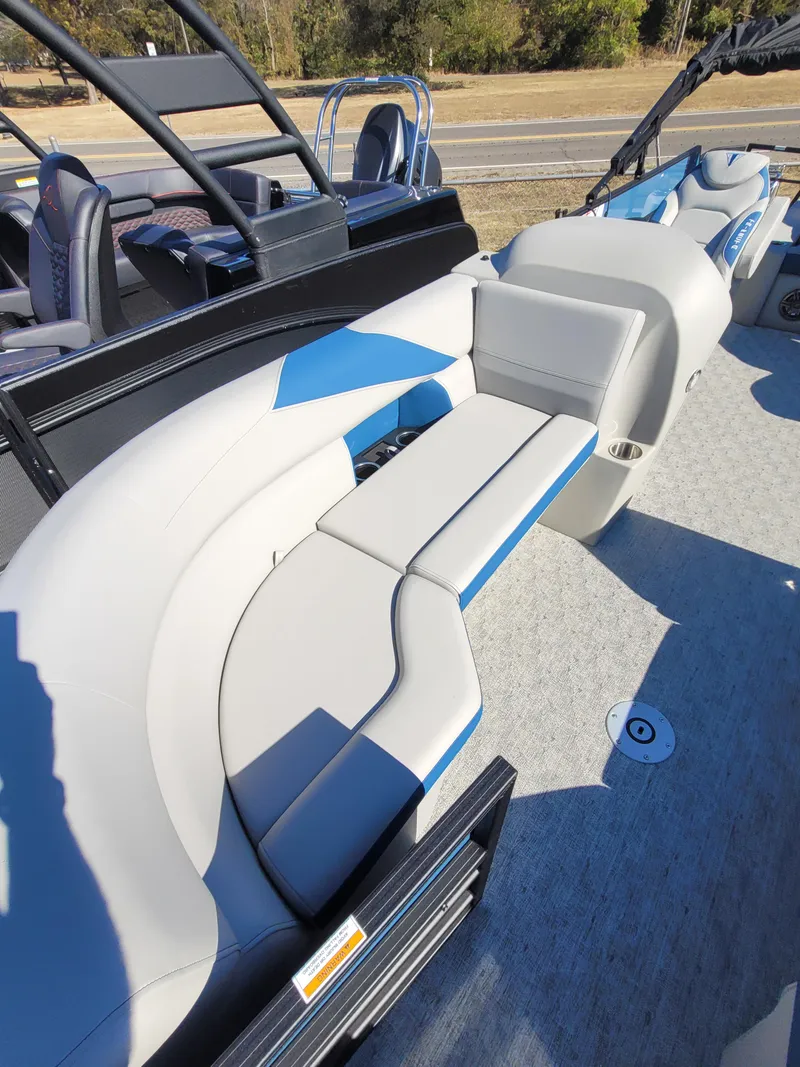 Slide: The Image of 2025 Trifecta 24ULLET275 pontoon boat with modern seating and sleek design. - 5
