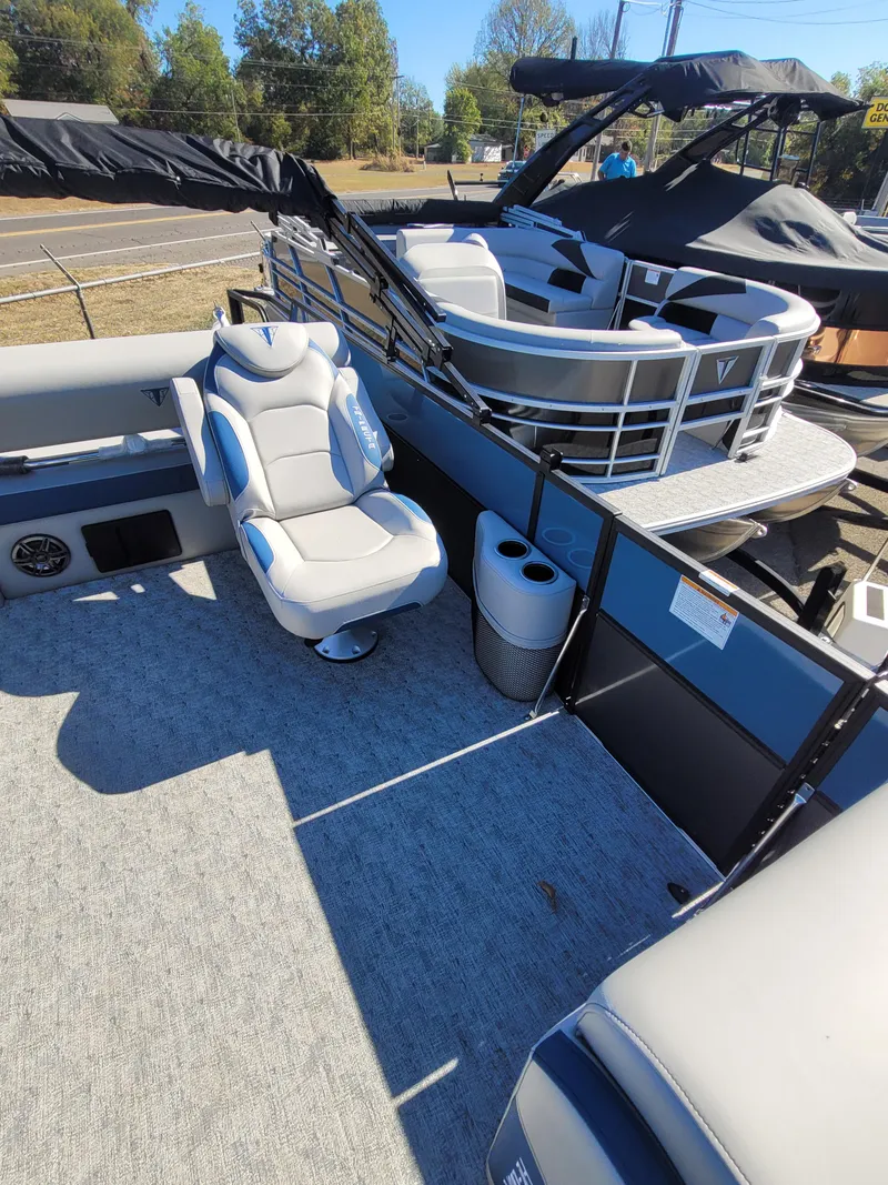 Slide: The Image of 2025 Trifecta 24ULLET275 pontoon boat with plush seating and modern design. - 7