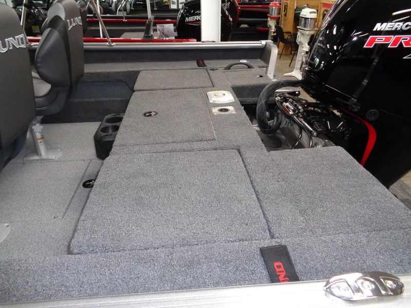 Slide: The Image of 2025 Lund 1875 Impact XS Sport boat interior with Mercury Pro outboard engine. - 13