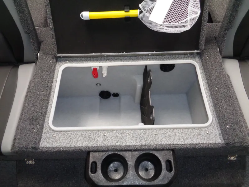 Slide: The Image of 2025 Lund 1875 Impact XS Sport boat storage compartment with cup holders and fishing net. - 18
