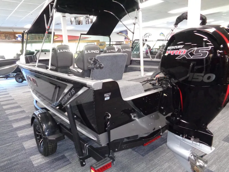 Slide: The Image of 2025 Lund 1875 Impact XS Sport boat with Mercury Pro XS 150 engine in showroom. - 28