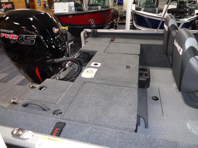 Slide: The Image of 2025 Lund 1875 Impact XS Sport boat interior with Pro XS engine. - 4