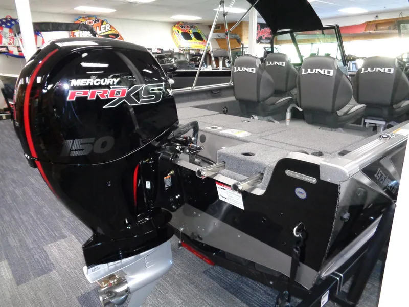 Slide: The Image of 2025 Lund 1875 Impact XS Sport boat with Mercury Pro XS 150 engine in showroom. - 5