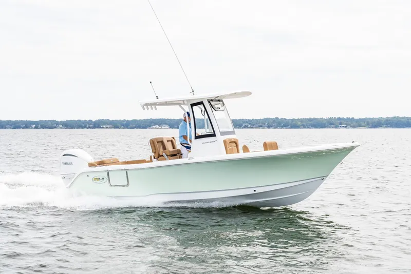 Slide: The Image of 2025 Sea Hunt Ultra 235 SE boat cruising on open water. - 9
