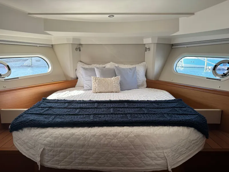 Slide: The Image of Luxurious bedroom interior of 2020 Beneteau Swift Trawler 41 Fly yacht. - 9