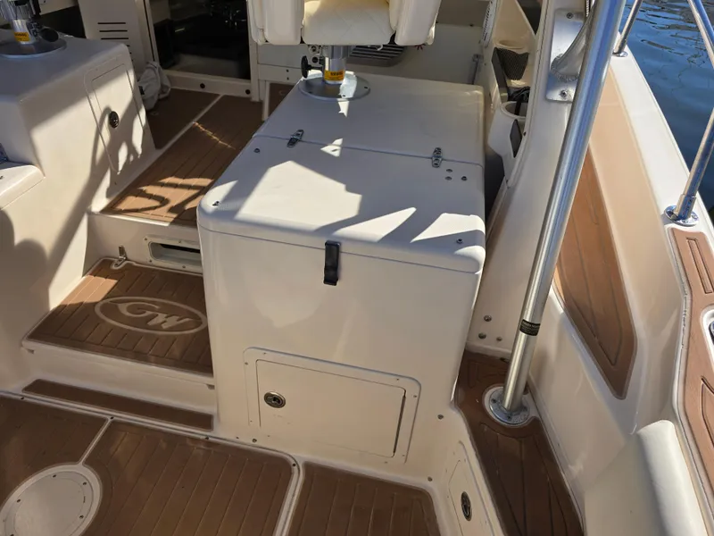Slide: The Image of 2009 Grady-White Marlin 300 boat interior with seating and storage. - 14