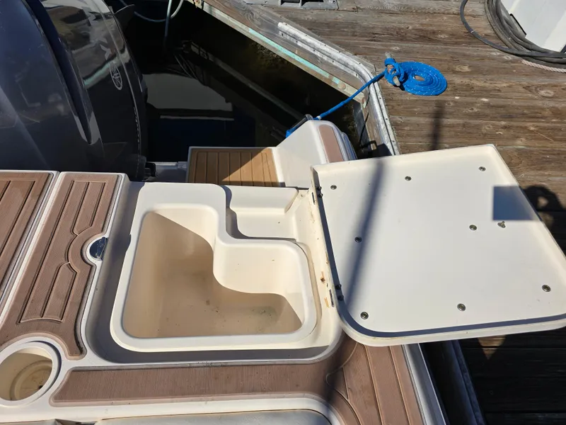 Slide: The Image of 2009 Grady-White Marlin 300 boat deck with open storage compartment. - 22