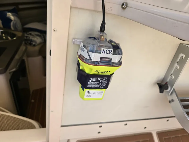 Slide: The Image of ACR emergency beacon mounted on 2009 Grady-White Marlin 300 boat interior. - 28