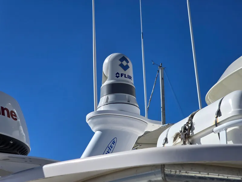 Slide: The Image of FLIR camera on 2009 Grady-White Marlin 300 boat under clear blue sky. - 29