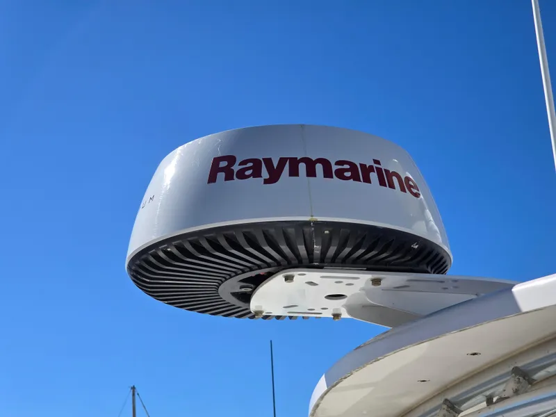 Slide: The Image of Raymarine radar on 2009 Grady-White Marlin 300 boat against clear blue sky. - 30
