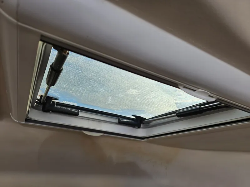 Slide: The Image of Boat hatch window on 2009 Grady-White Marlin 300, partially open. - 31