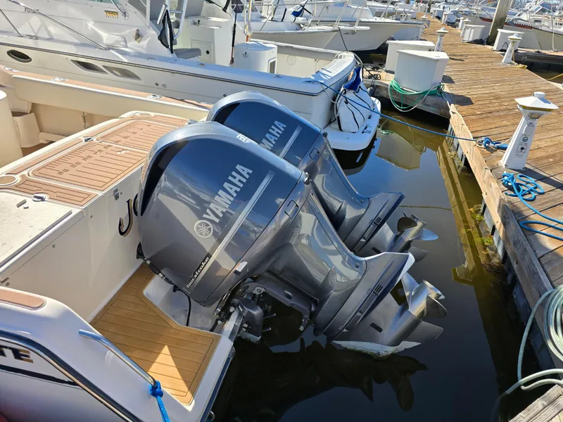 Slide: The Image of 2009 Grady-White Marlin 300 with Yamaha outboard engines docked at marina. - 6