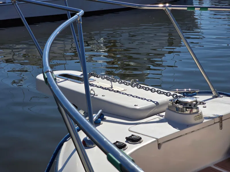 Slide: The Image of Grady-White Marlin 300 boat bow with anchor chain, 2009 model, docked on calm water. - 7
