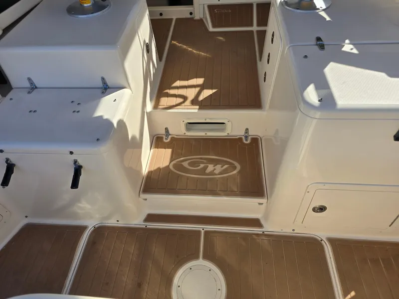 Slide: The Image of 2009 Grady-White Marlin 300 boat interior with wood finish and storage compartments. - 9