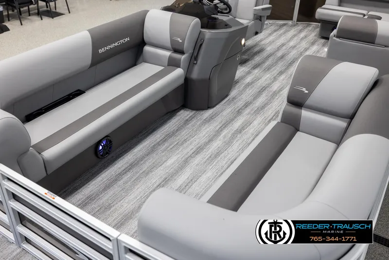 Slide: The Image of 2025 Bennington 21 SLSE pontoon boat interior with gray seating and striped flooring. - 10