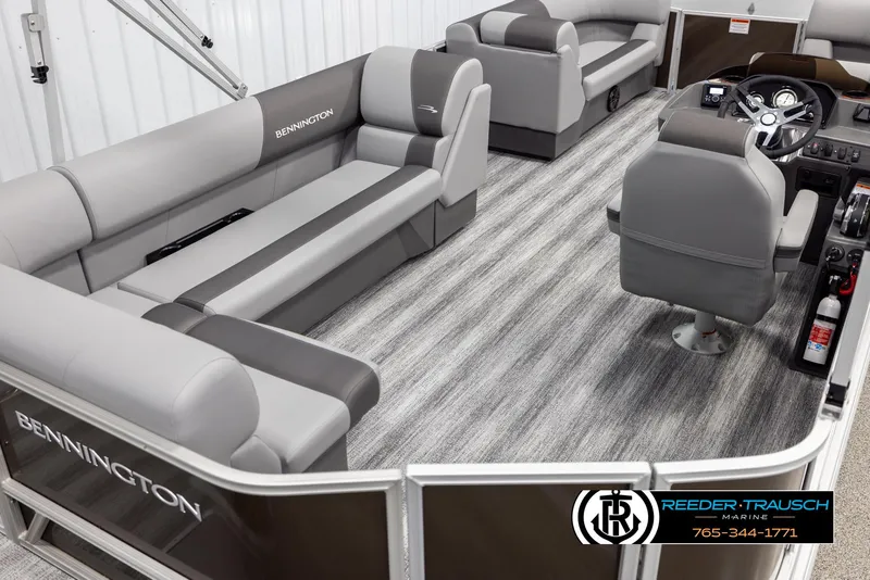 Slide: The Image of 2025 Bennington 21 SLSE pontoon boat interior with gray seating and modern design. - 12