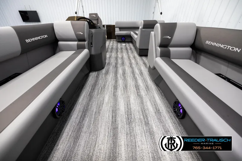 Slide: The Image of 2025 Bennington 21 SLSE pontoon boat interior with gray seating and modern design. - 13