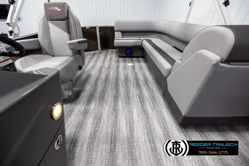 Slide: The Image of 2025 Bennington 21 SLSE boat interior with gray seating and carpet flooring. - 14