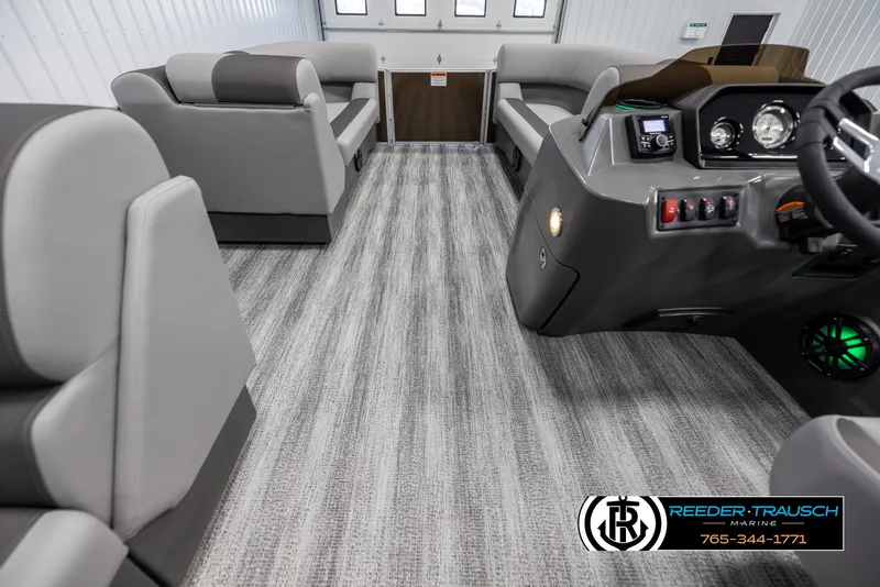 Slide: The Image of Interior of 2025 Bennington 21 SLSE pontoon boat with modern seating and control panel. - 17