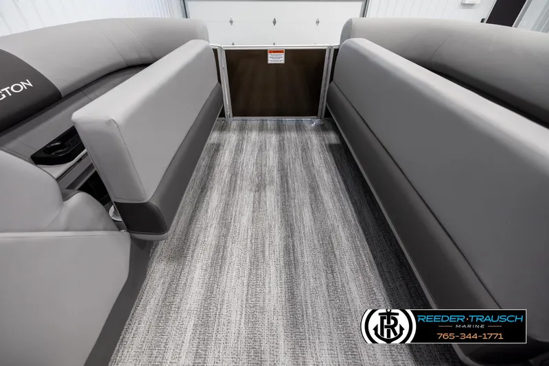 Slide: The Image of 2025 Bennington 21 SLSE pontoon boat interior with gray seating and carpet flooring. - 19