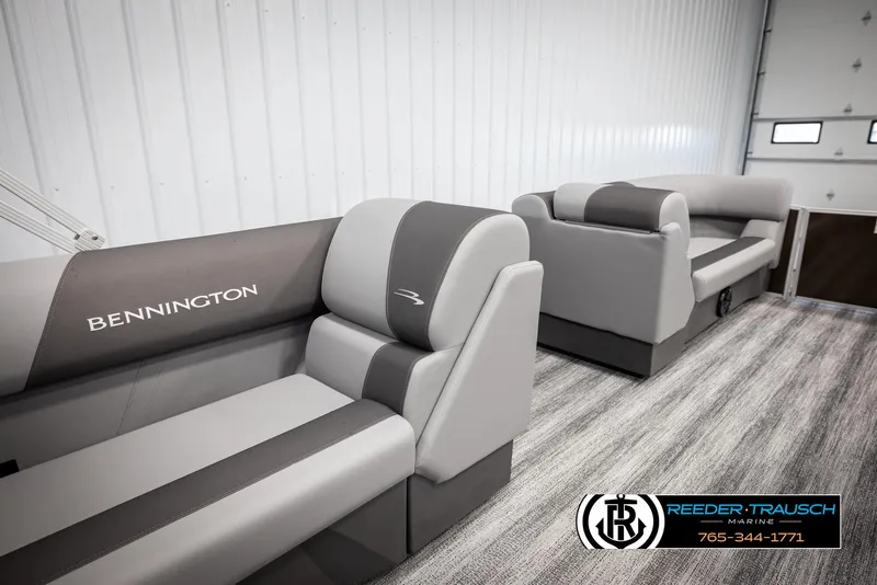 Slide: The Image of 2025 Bennington 21 SLSE boat interior with gray seating in showroom. - 20