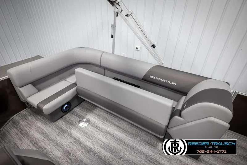 Slide: The Image of 2025 Bennington 21 SLSE pontoon boat interior with gray seating and carpeted flooring. - 24