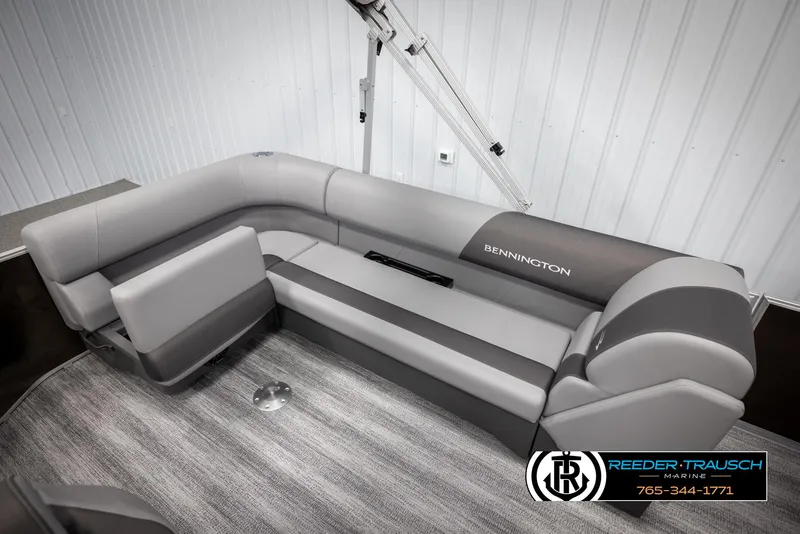 Slide: The Image of 2025 Bennington 21 SLSE pontoon boat interior with gray seating and carpeted flooring. - 25